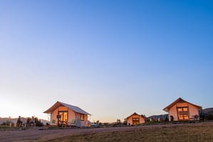 Evening light and glowing glamping tents