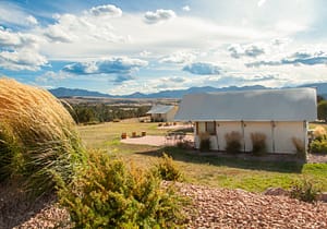 Family enjoying a luxury glamping tent experience at Royal Gorge Cabins in Colorado.