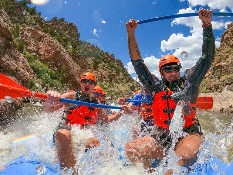 rafters getting splashed by wave while rafting the Royal Gorge