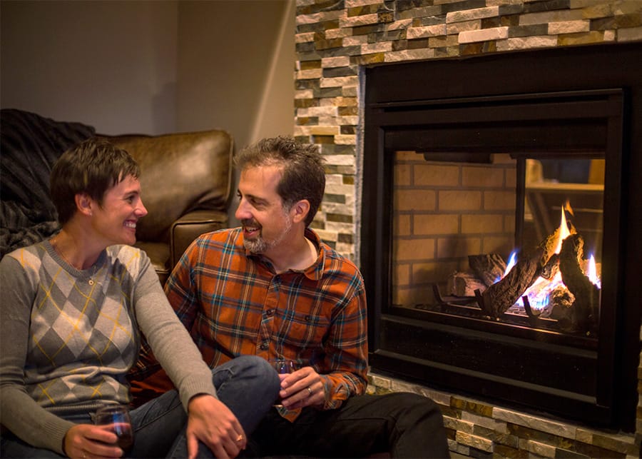 A couple enjoying a cozy cabin rental in Colorado.