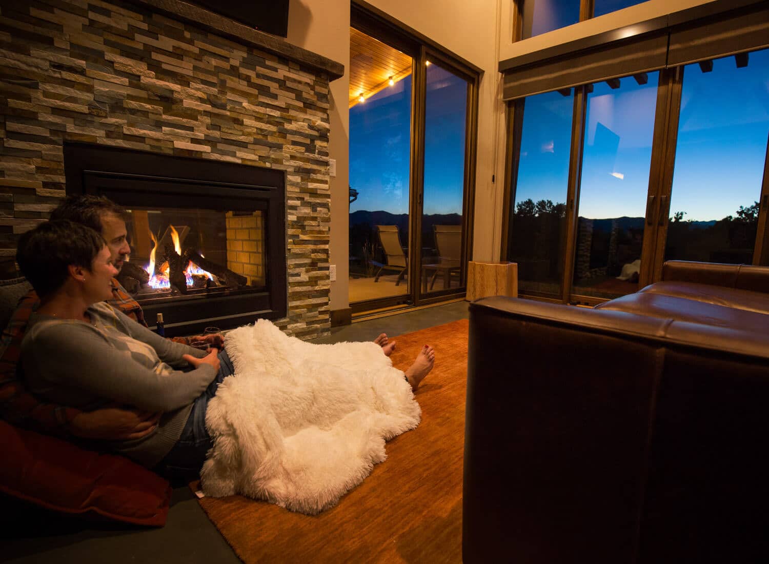 Cozy double sided fireplace in each cabin