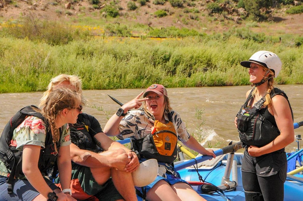 guides joking around at river put-in