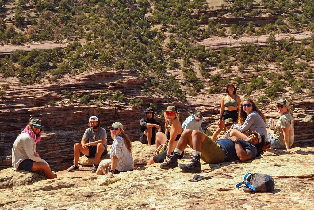 group of guides resting on overlook point on Green River