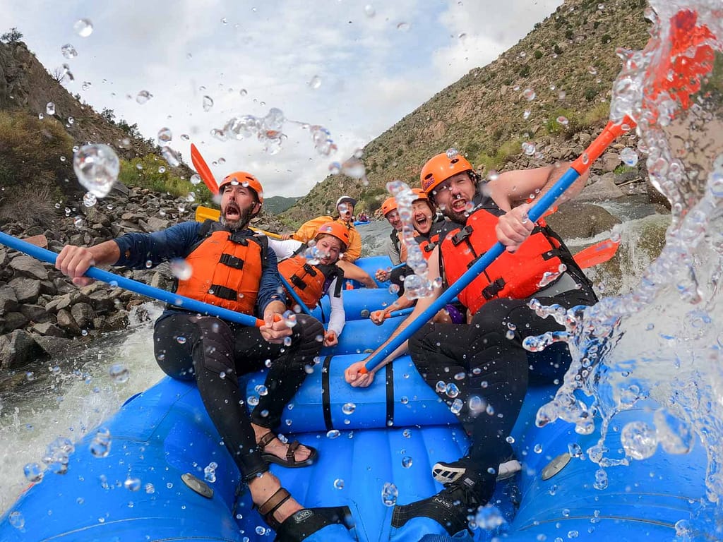 Rafters brace for a large wave to hit their raft