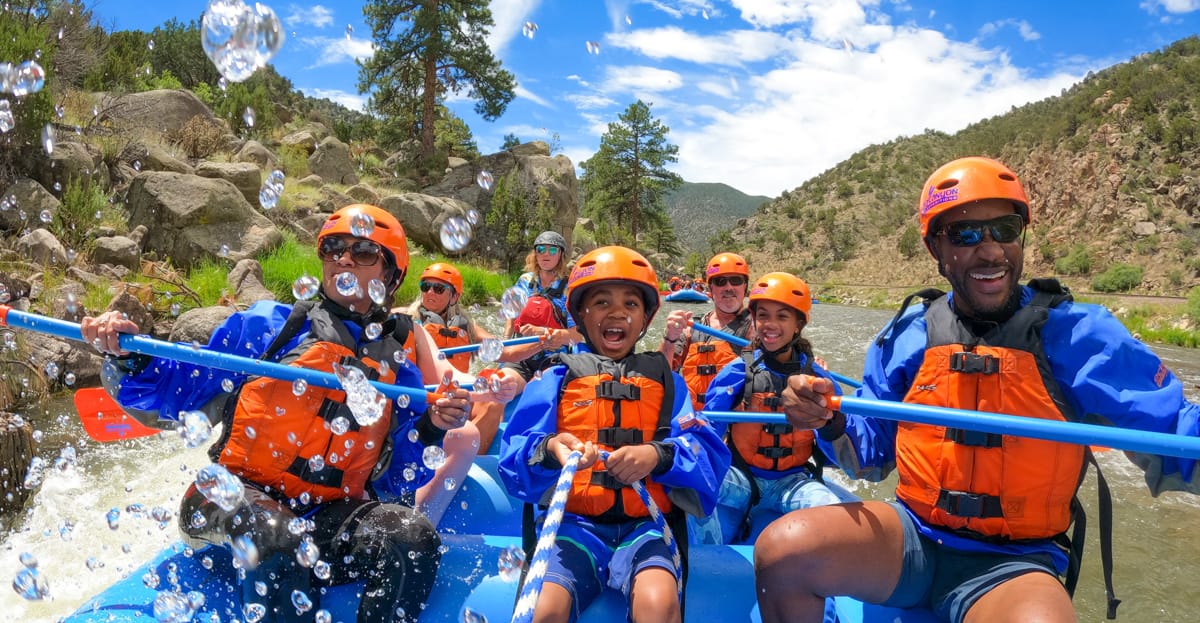 Rafters paddling through Arkansas River whitewater near Colorado Springs with Echo Canyon River Expeditions