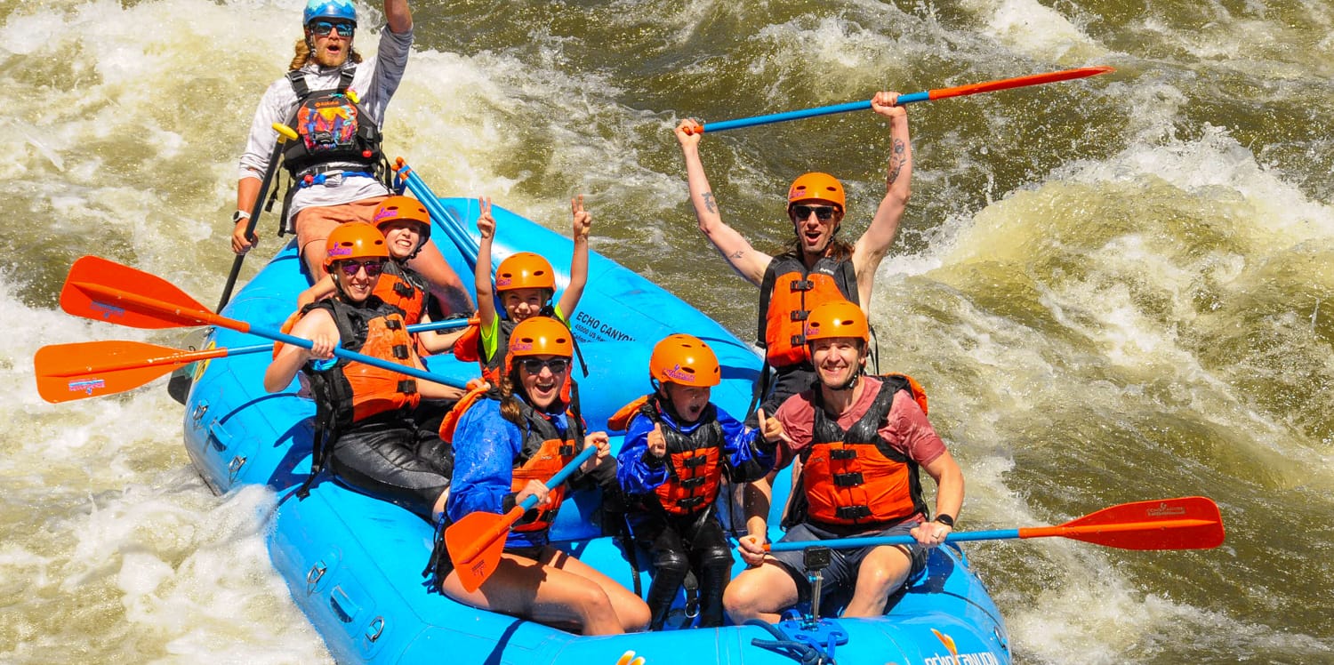 Family on a guided Arkansas River rafting trip with Echo Canyon River Expeditions through Bighorn Sheep Canyon