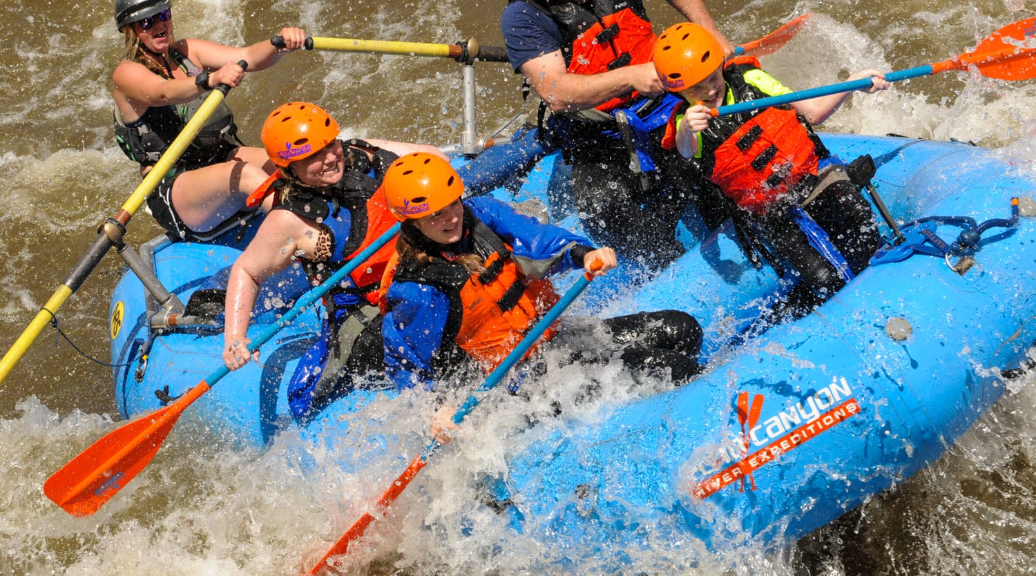 Family rafting splashy whitewater on the Arkansas River with an Echo Canyon guide