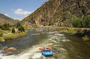Group rafting trips on the Arkansas River with Echo Canyon guides navigating Bighorn Sheep Canyon rapids