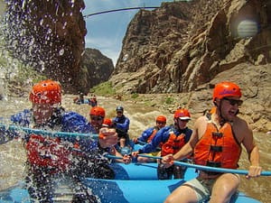 raft under the Royal Gorge Bridge on class IV rapids