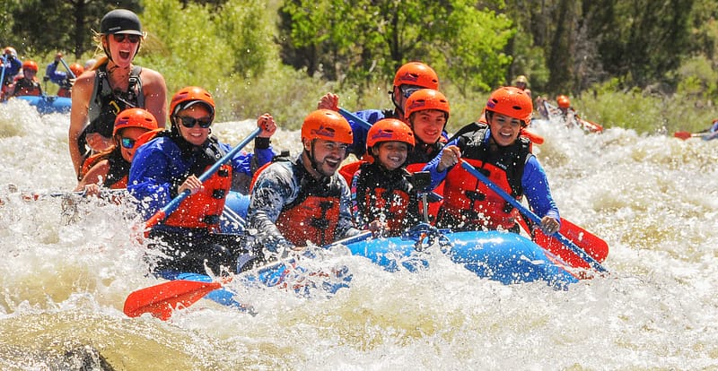 Family rafting Class III rapids in Bighorn Sheep Canyon on the Arkansas River near Denver with Echo Canyon River Expeditions