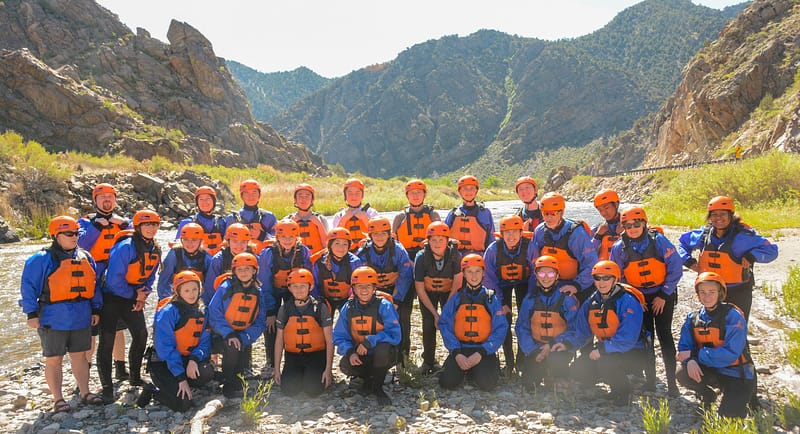 A large group rafting together through Bighorn Sheep Canyon on the Arkansas River near Colorado Springs