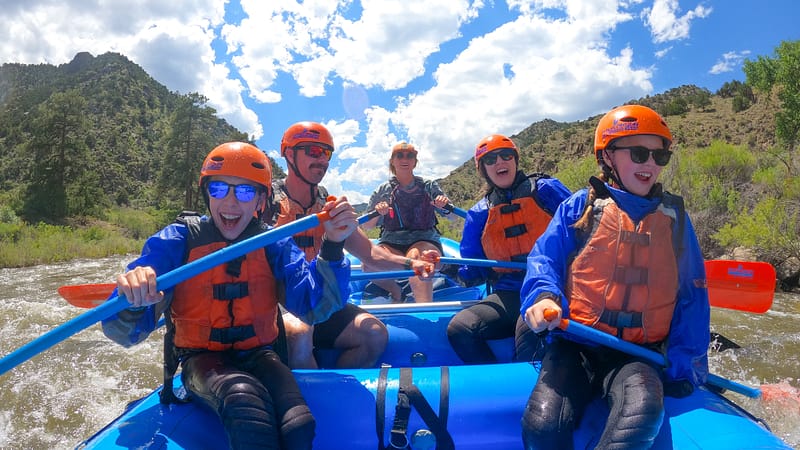 Family group rafting together on the Arkansas River with Echo Canyon River Expeditions guides
