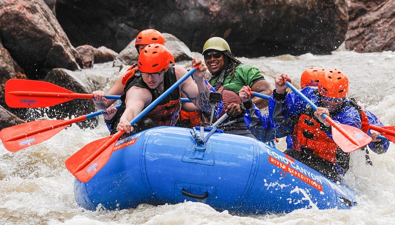 Rafters paddling Class IV whitewater through the Royal Gorge below the Royal Gorge Bridge on the Arkansas River
