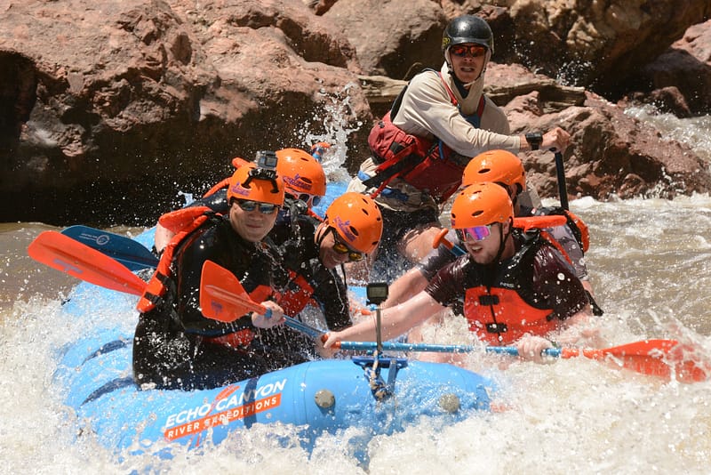 Family smiling after a whitewater rafting trip with Echo Canyon River Expeditions on the Arkansas River