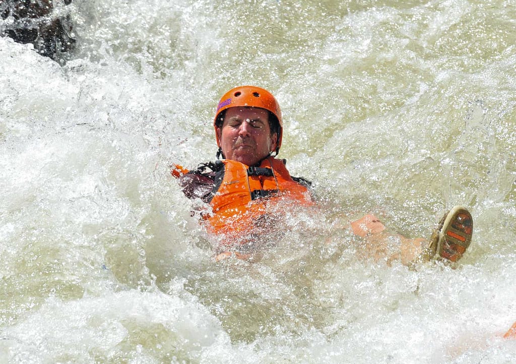 a swimmer assumes the white water swim position