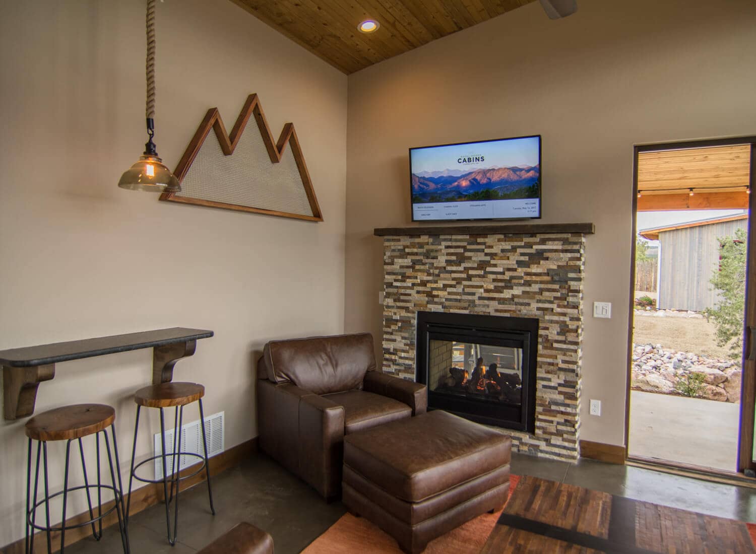 Single King Cabin fireplace and living room
