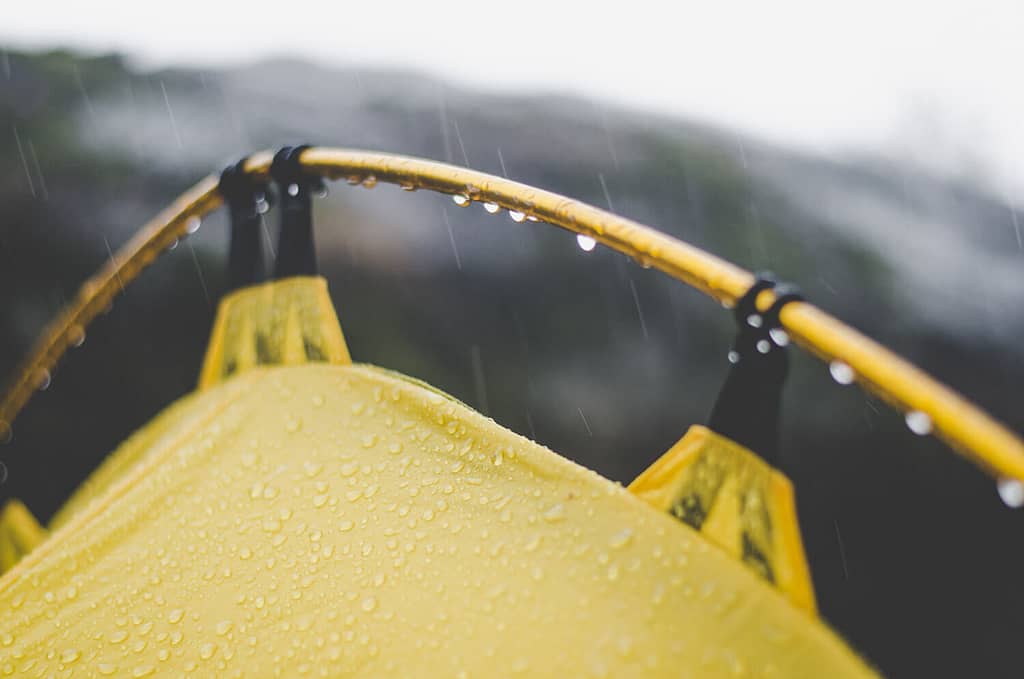 raindrops falling on tent and tent poles